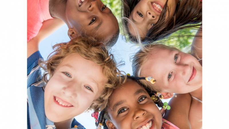 Five kids faces in a circle